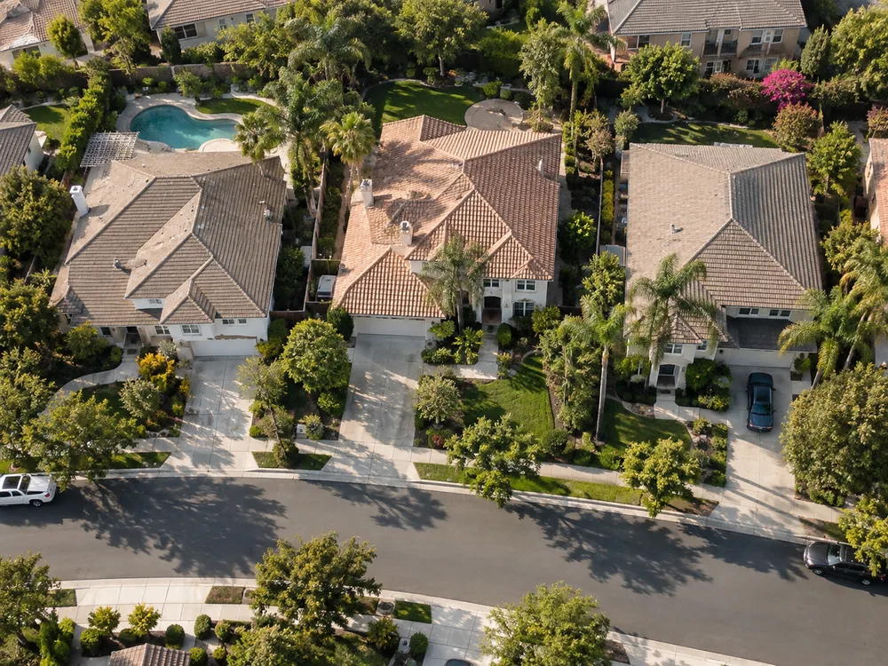 Illustrative aerial view of neighborhood rooftops